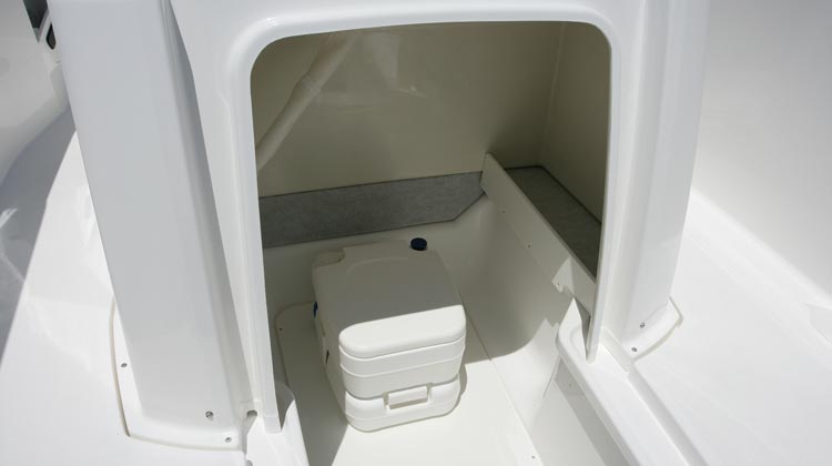 Console compartment with space to fit chemical toilet